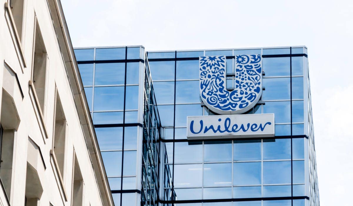 Logo of public company Unilever displayed on a smartphone. Grey background.  Credit: PIXDUCE Stock Photo - Alamy