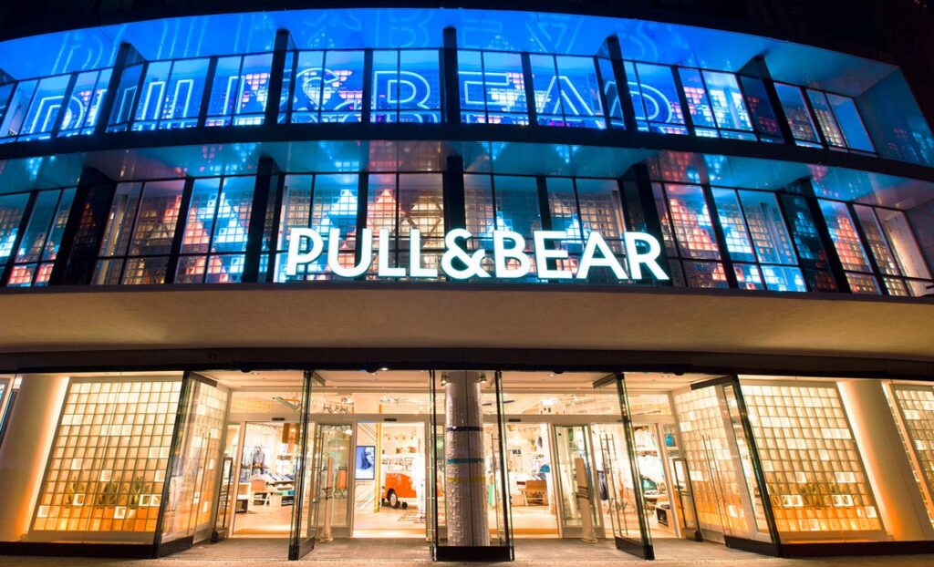 Photo of a Pull&Bear store, showing urban-casual brand aesthetic. Denim, streetwear, laid-back styling.