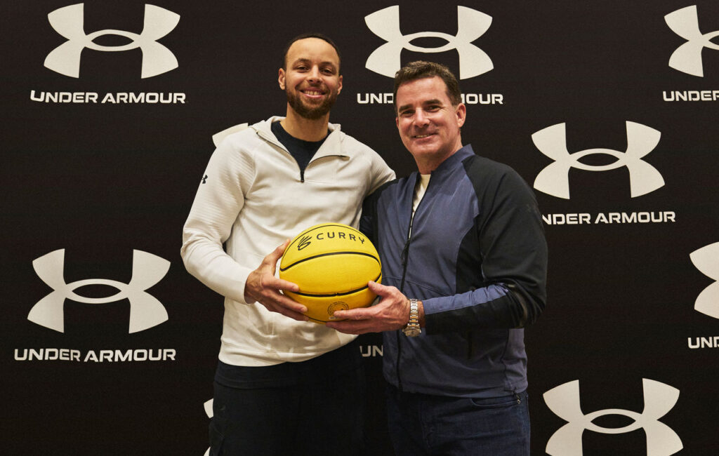 Stephen Curry and Kevin Plank poses after a groundbreaking deal of athlete with the brand