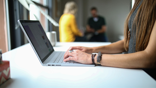 a girl working on a laptop